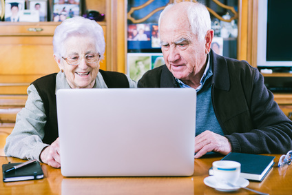 Senior couple working with Laptop at home